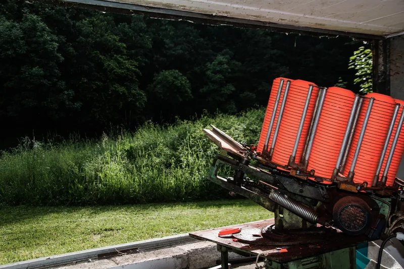 Clay pigeon trap loaded with orange clays at the Arzberg trap range